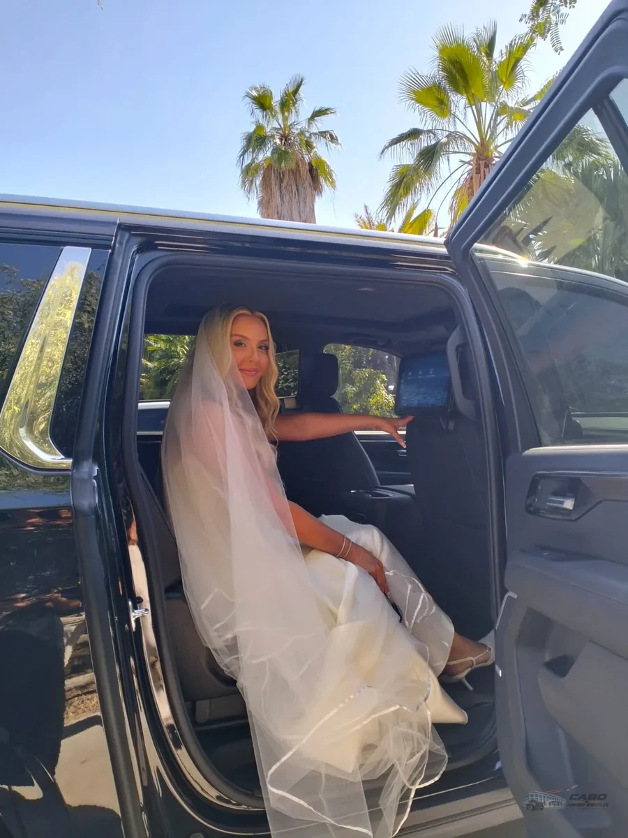 Bride seated inside a private SUV for wedding transportation in Los Cabos.